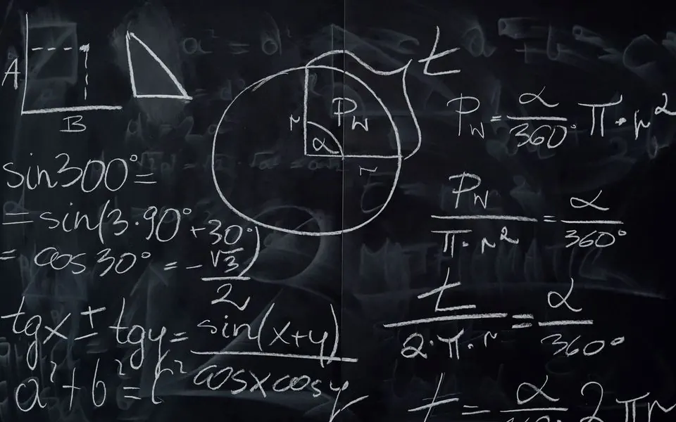 Chalk arithmetic in the corner of a blackboard.