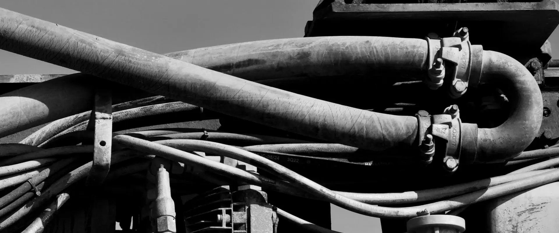 Cables and pipework running across industrial machinery.